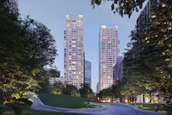 Visual render of two residential towers at dusk, overlooking Victory Park in East Village, London