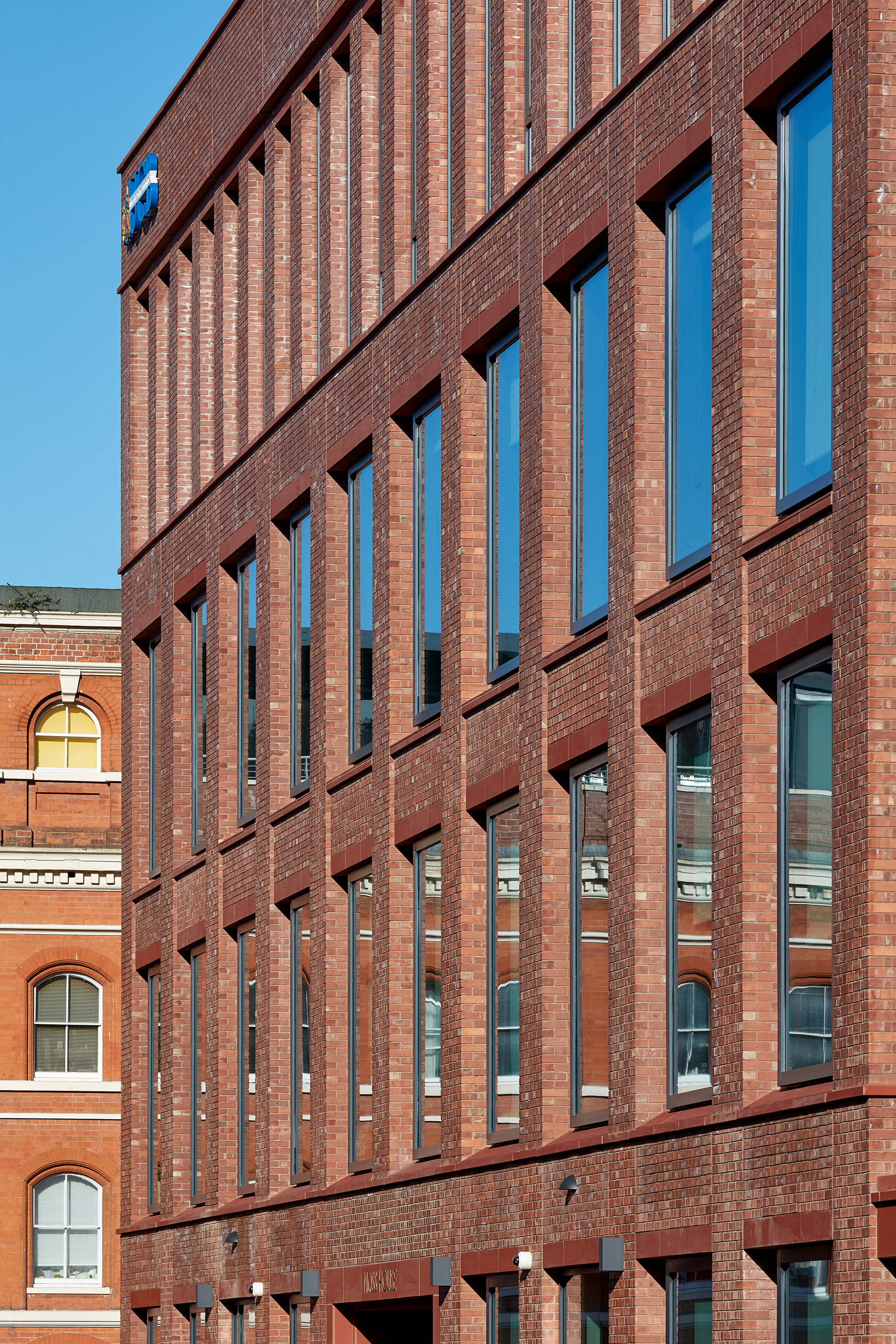 The teaching building is clad with Burlington Orange brick