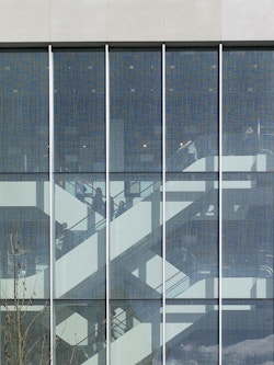 The glass cladding featuring ceramic artwork by Andrew ﻿Moor