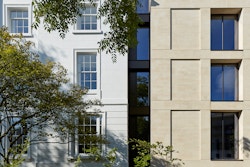 A contemporary, modular, stone façade links the two historic villas.